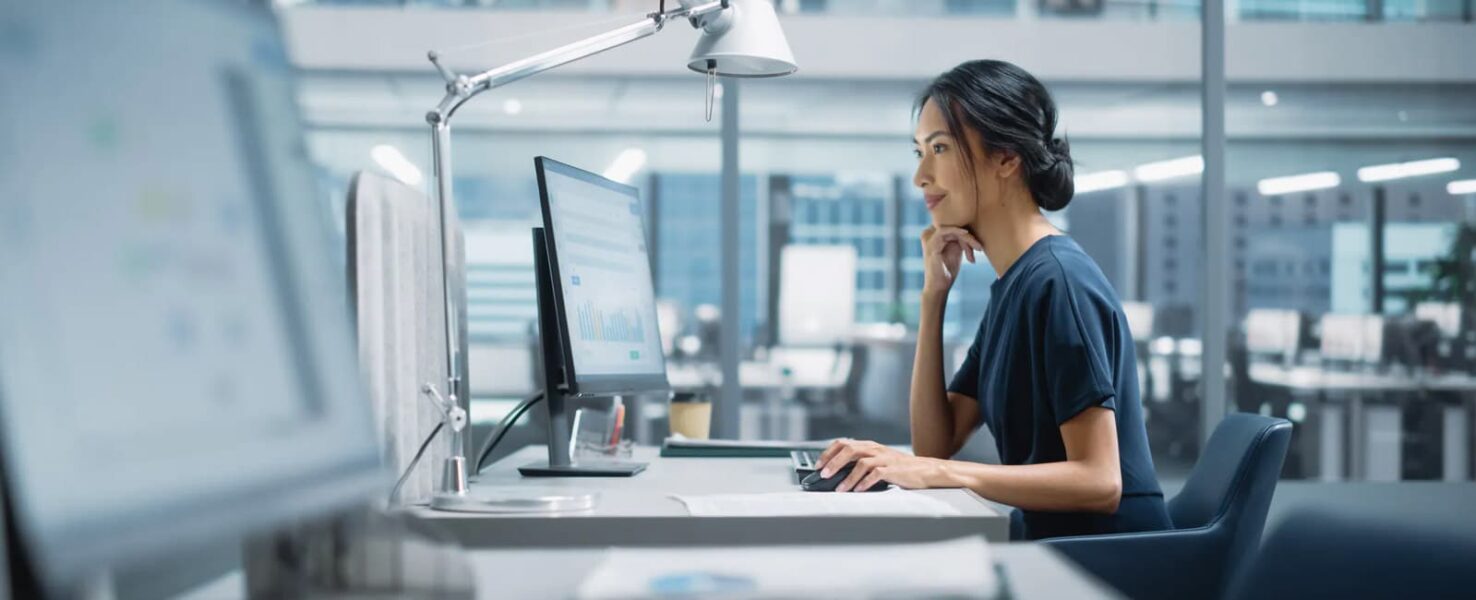A woman working in an office utilizing cloud continuity features
